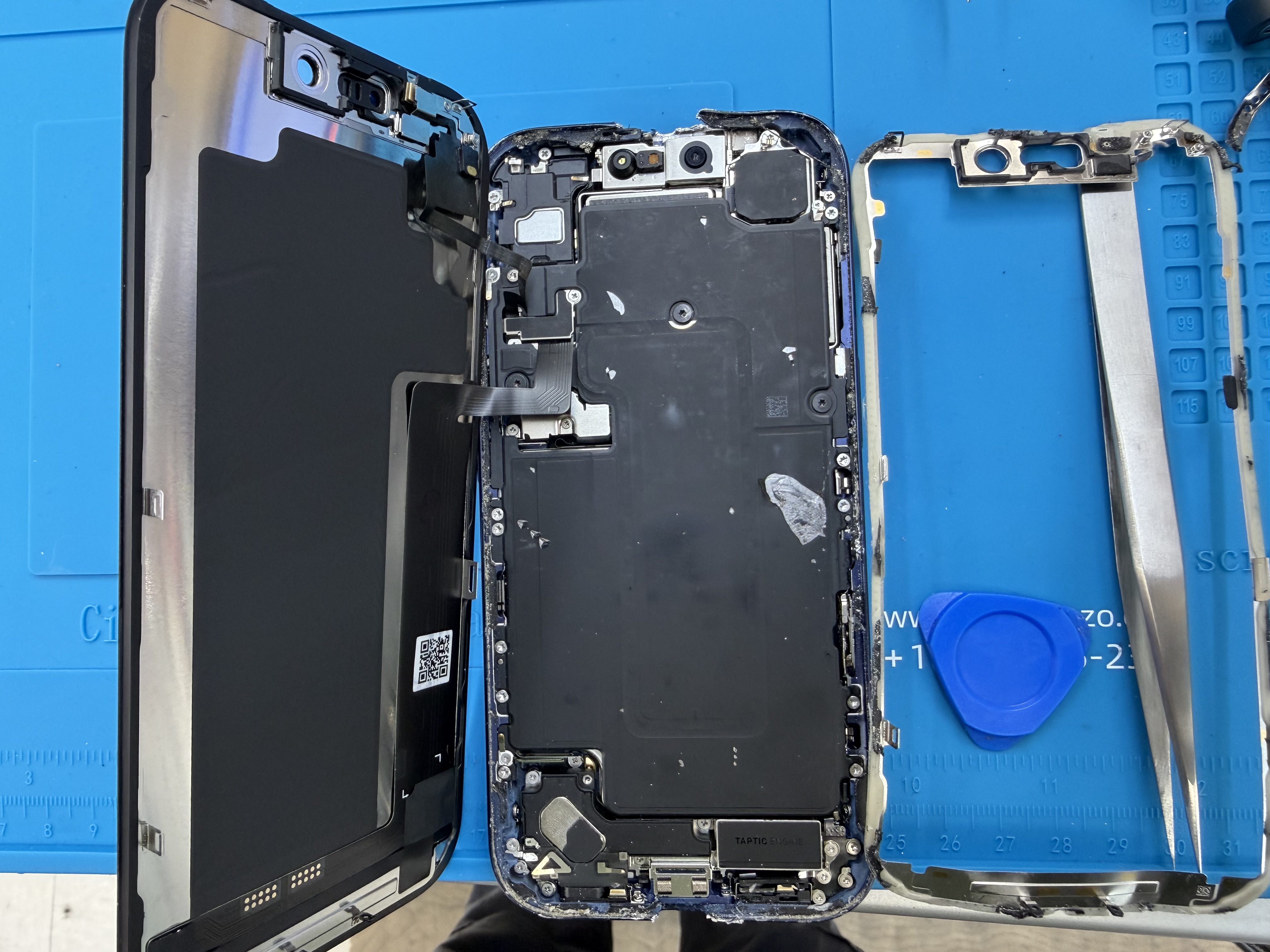 Electronics Garden Repair technician performing on-site iPhone repair in NYC